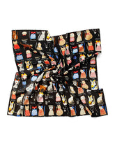 A chic black and white silk scarf showcasing whimsical cat designs, ideal for adding flair to any outfit.
