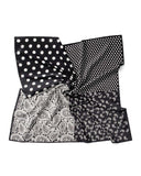 A silk scarf featuring a black and white polka dot design complemented by an elegant paisley print.