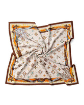 A silk scarf featuring a Feather Alphabet pattern in white and brown with an orange and brown design.
