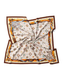 A silk scarf featuring a Feather Alphabet pattern in white and brown with an orange and brown design.