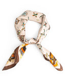 A knotted silk scarf in brown and orange, adorned with a unique feather alphabet pattern.