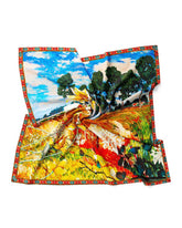 A luxurious silk scarf adorned with a picturesque painting of a lush field and trees, blending elegance with nature.
