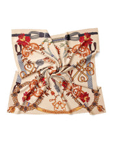 A silk scarf featuring a vintage chain pattern, elegantly displayed against a white background.