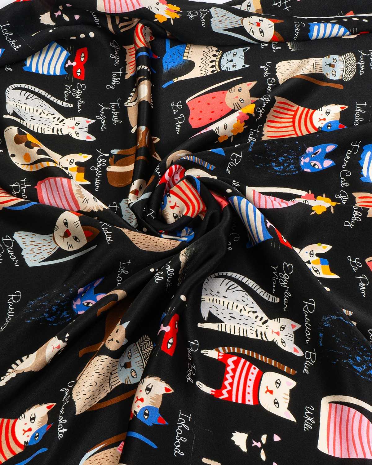 Detailed view of a silk scarf showcasing cats print, adorned with an array of colorful cats in a playful pattern.