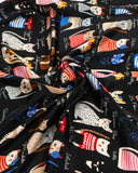 Detailed view of a silk scarf showcasing cats print, adorned with an array of colorful cats in a playful pattern.