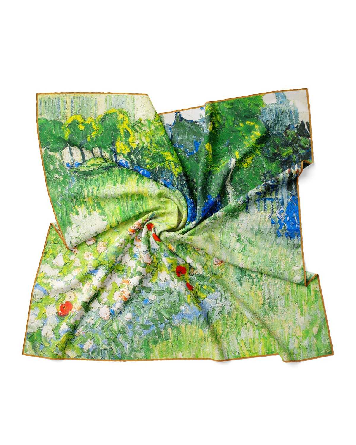 A luxurious silk scarf in green and white, beautifully decorated with a floral painting.