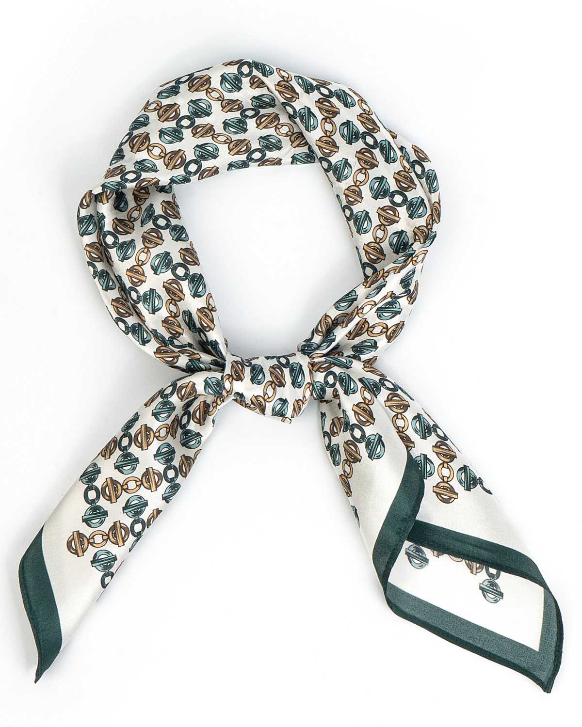 A chic white and green silk scarf, adorned with geometric pattern, elegantly knotted for a fashionable look.