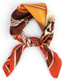 A knotted silk scarf featuring a brown and orange design, elegantly showcasing its vibrant colors and intricate patterns.