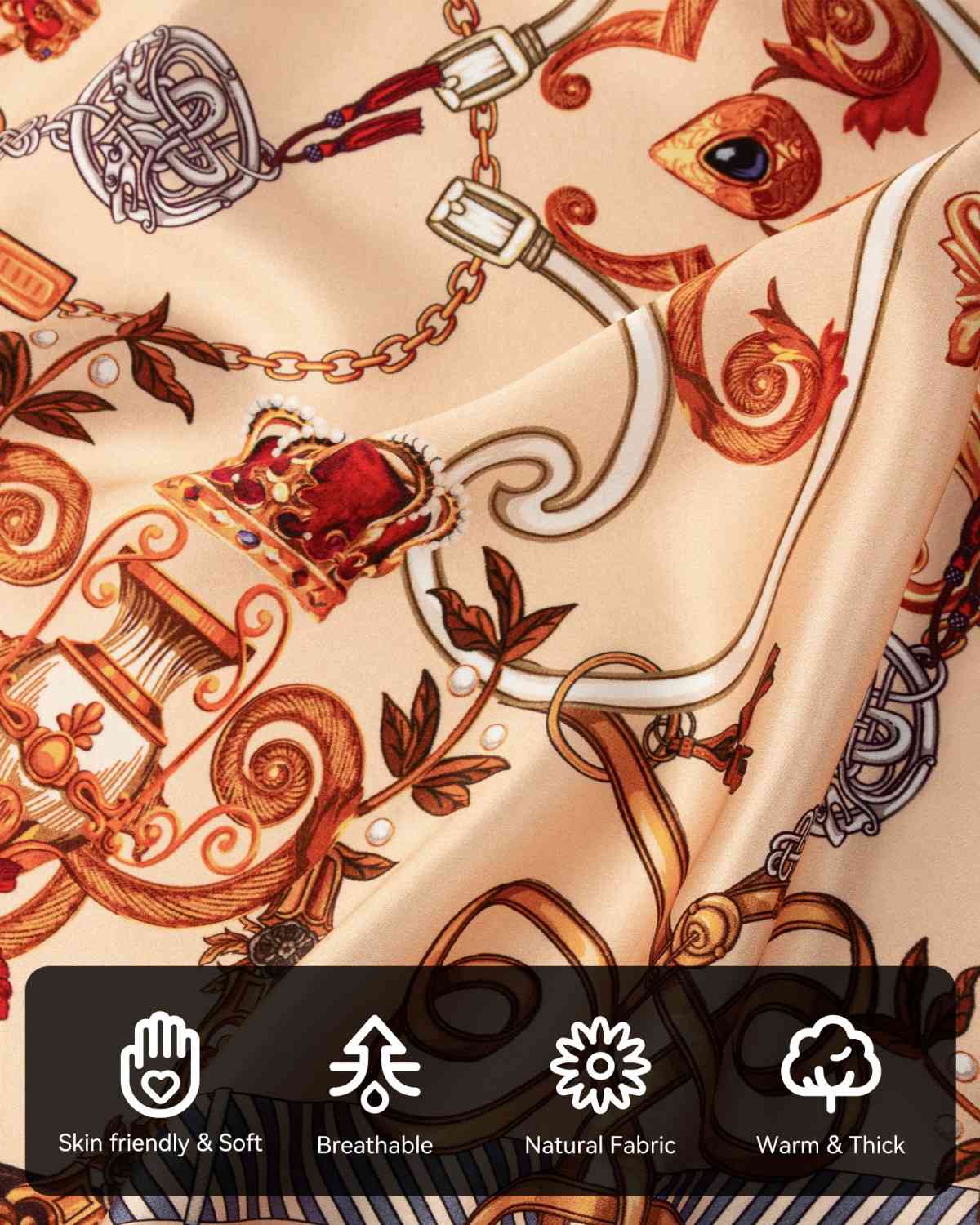 A close-up of a silk scarf with vintage chains and various symbols highlighting the characteristics and details of its material.