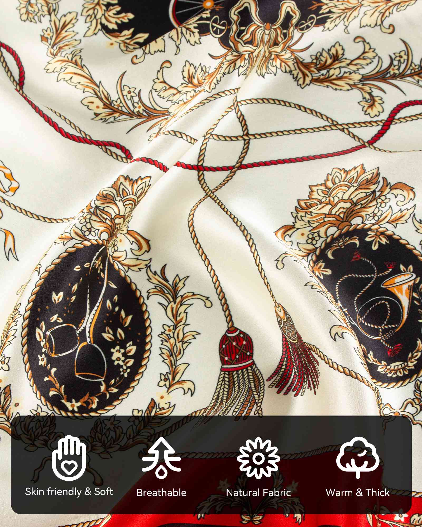 Close-up of a red and white silk scarf featuring intricate gold and black designs, showcasing its elegant texture and patterns.